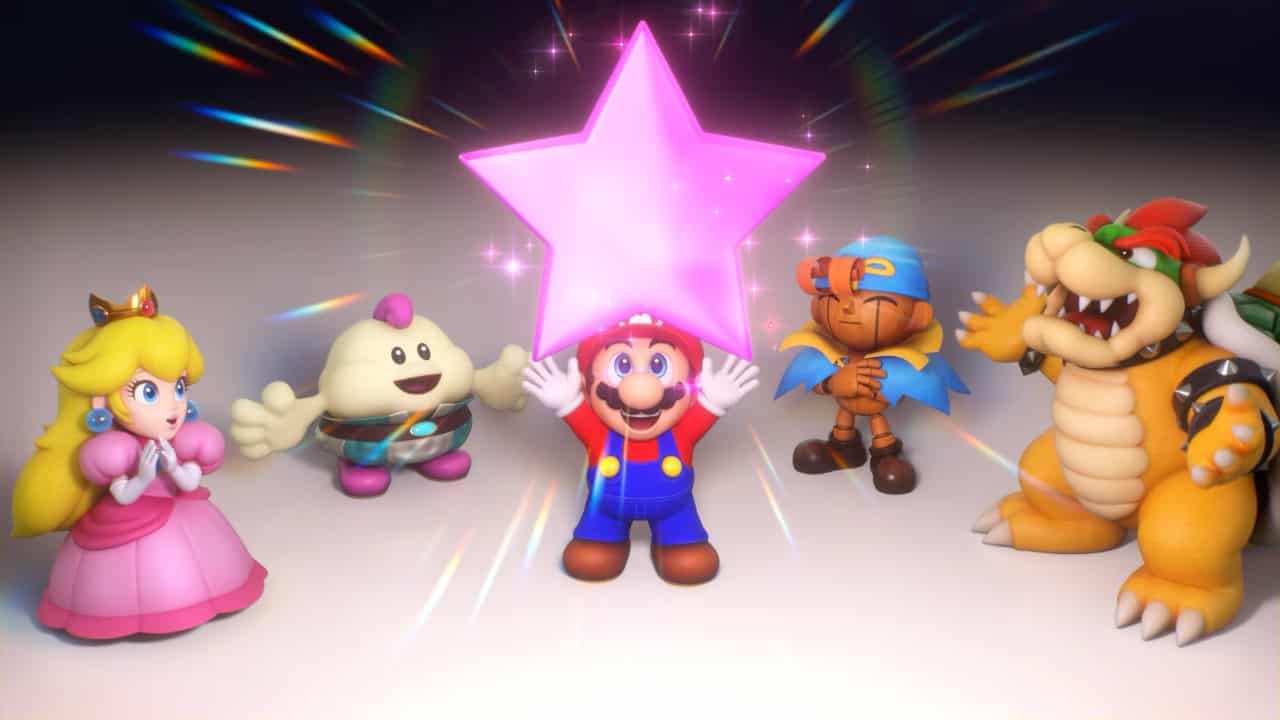Super Mario RPG review: Mario holding up a Star Piece surrounded by Peach, Bowser, Mallow, and Geno.