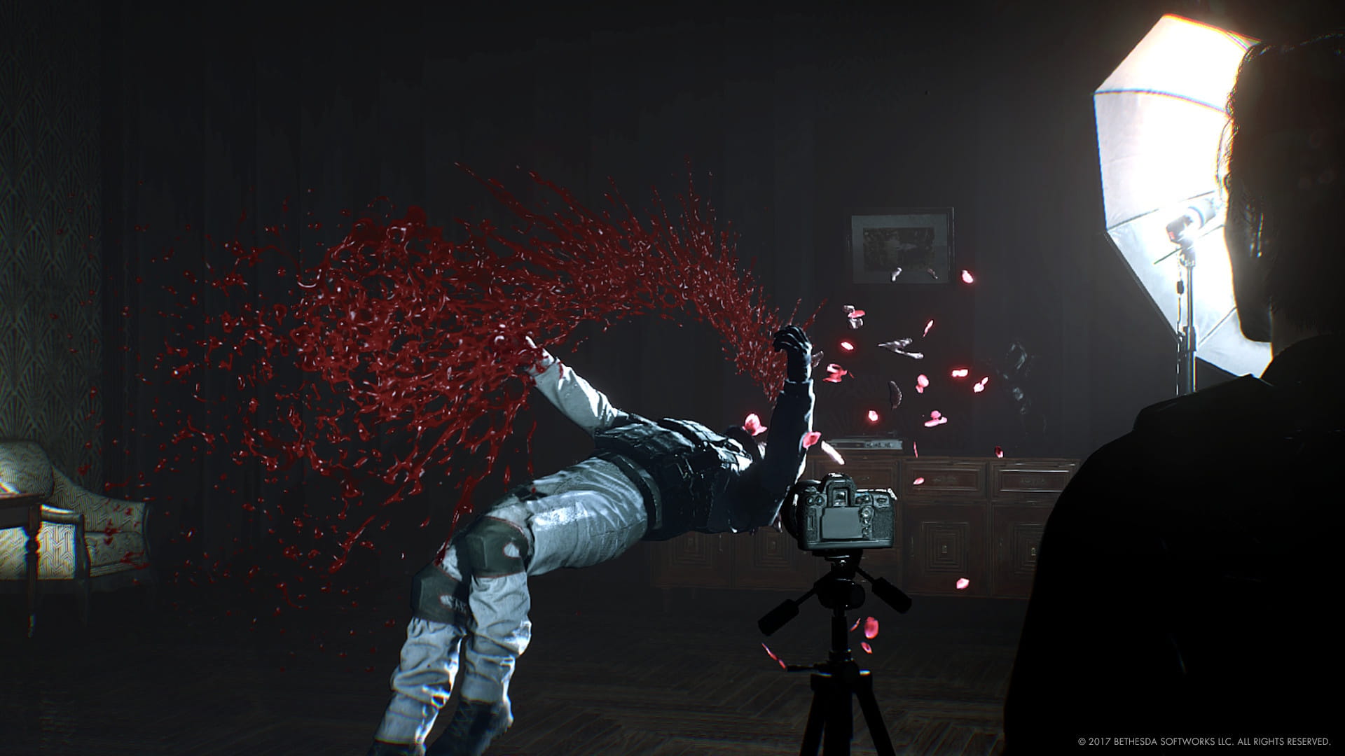 A gruesome crime scene created by the photographer boss in The Evil Within 2, capturing a victim frozen in midair as blood splashes dramatically across the room.