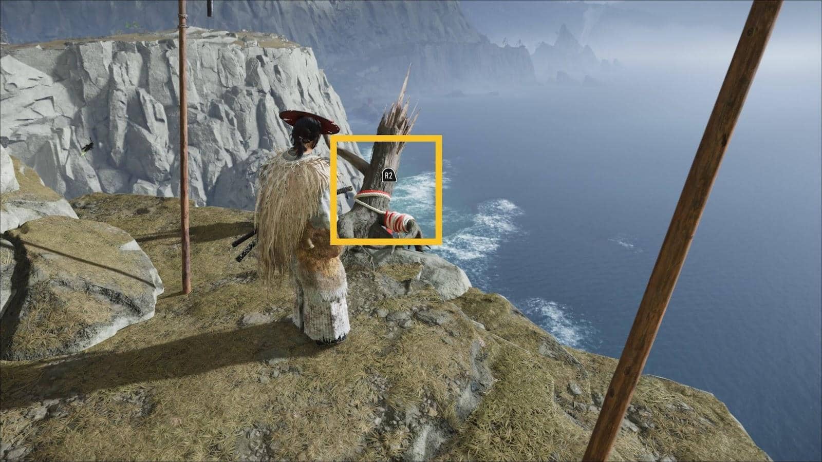 A character in traditional warrior attire stands on a cliff overlooking the ocean in Ghost of Yotei