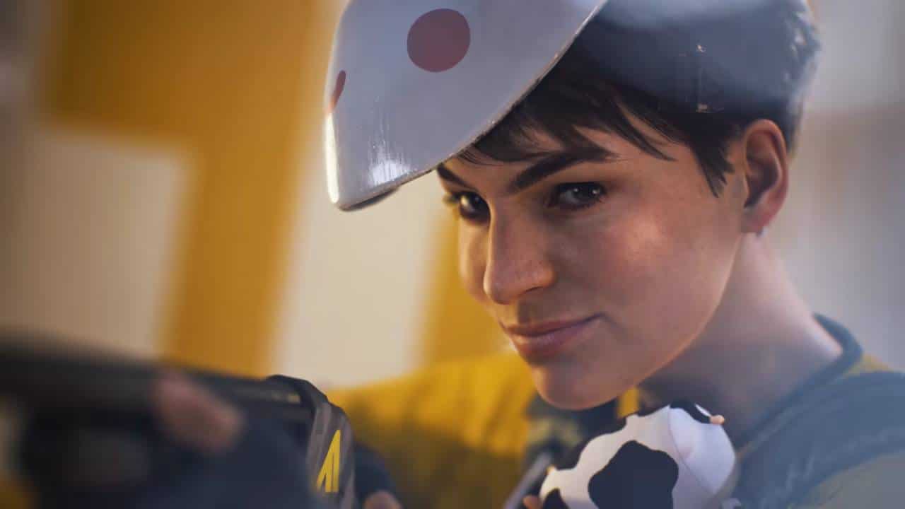 A woman wearing a cowboy hat is holding a gun, ready to punish rage quitting in The Finals.