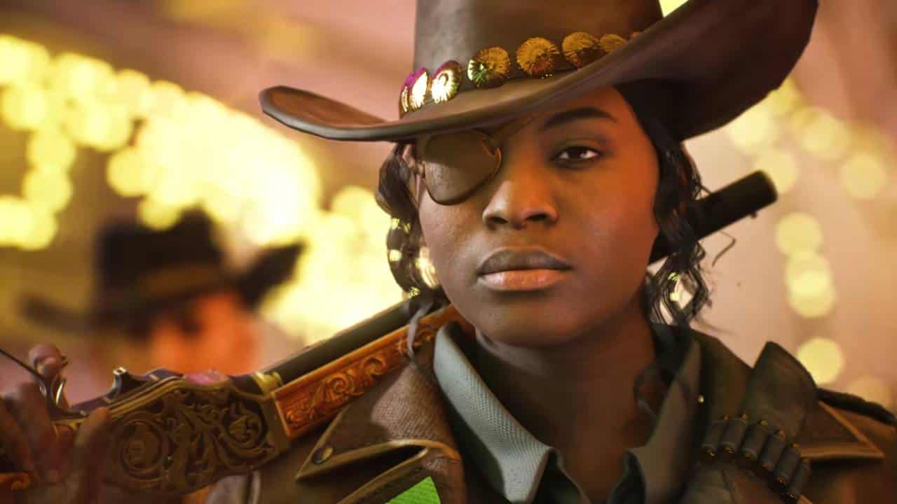 A woman in a cowboy hat holding a gun at The Finals.