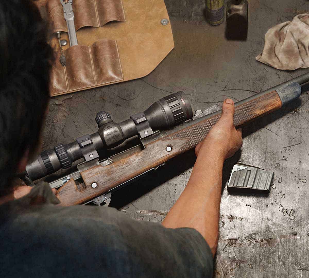 The Last of Us Part 1 a gun on a workbench, as it's upgraded by Joel