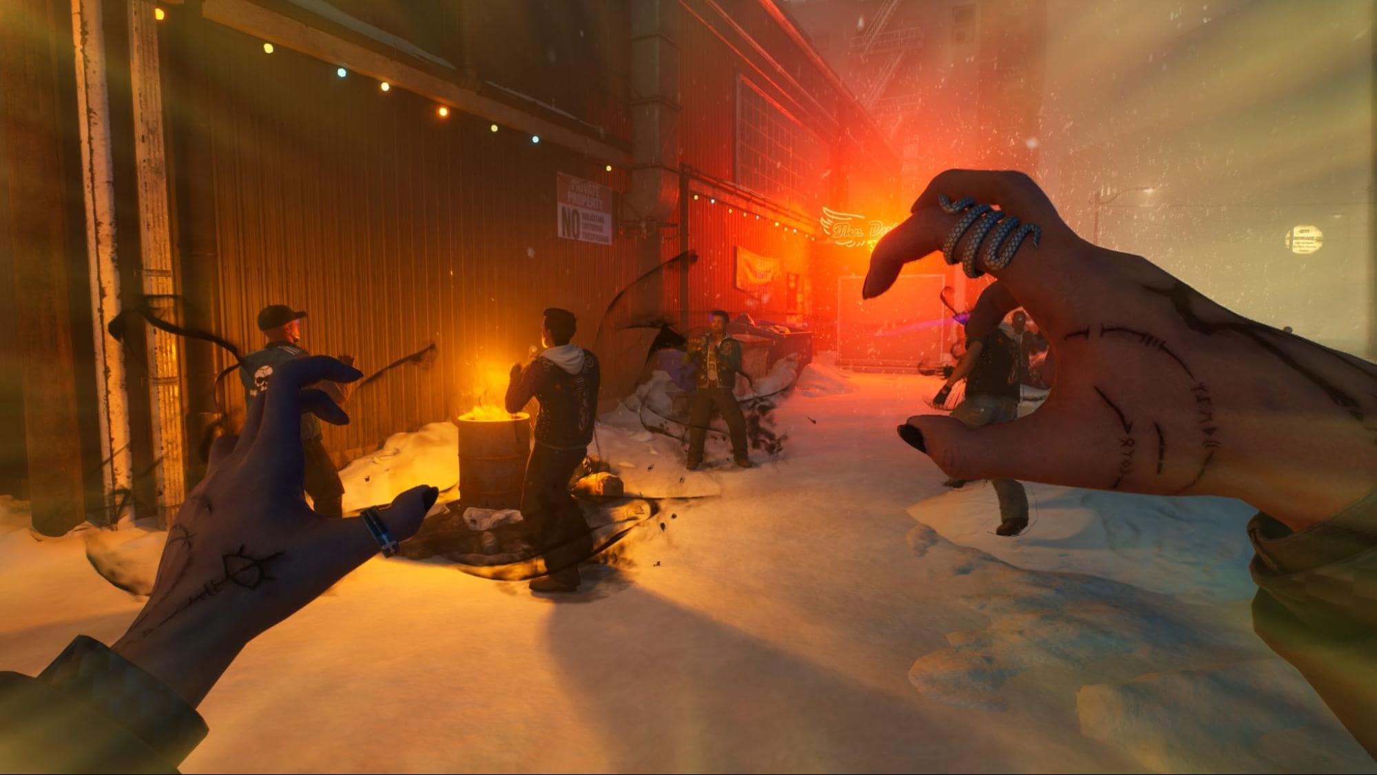 First-person view in Vampire The Masquerade - Bloodlines 2: a snowy alley at night reveals clawed hands in the foreground and people gathered by a burning barrel