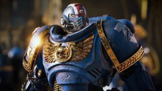A Space Marine in blue and gold power armour.