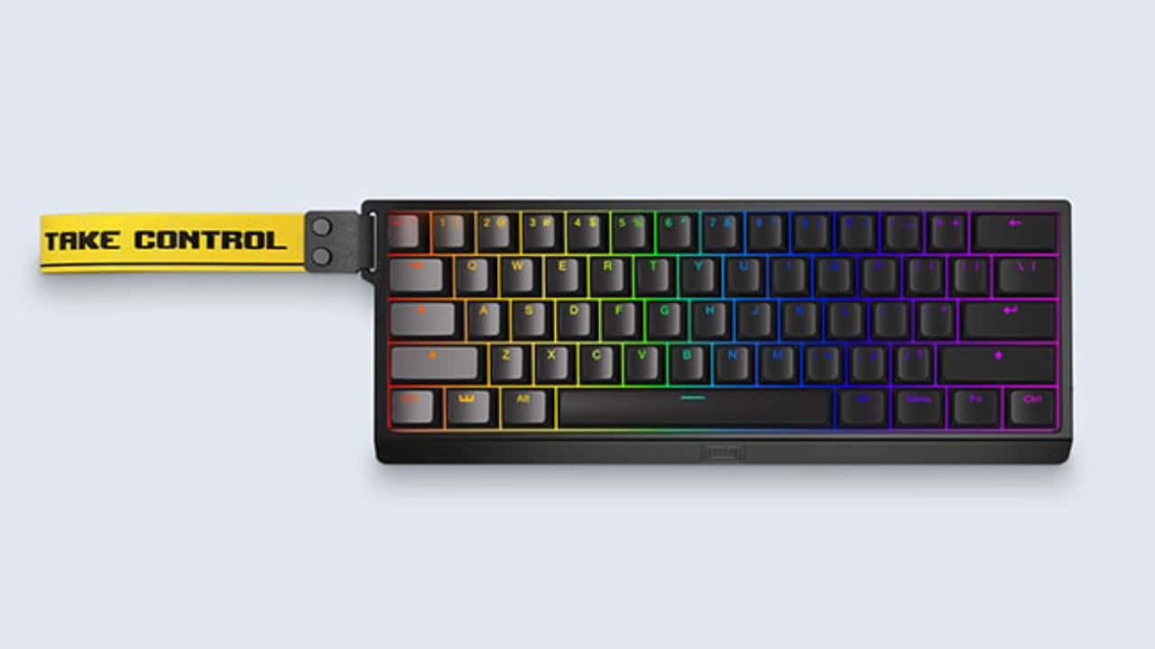 Mechanical keyboard with customizable RGB lighting and "take control" Valorant branded wrist rest.