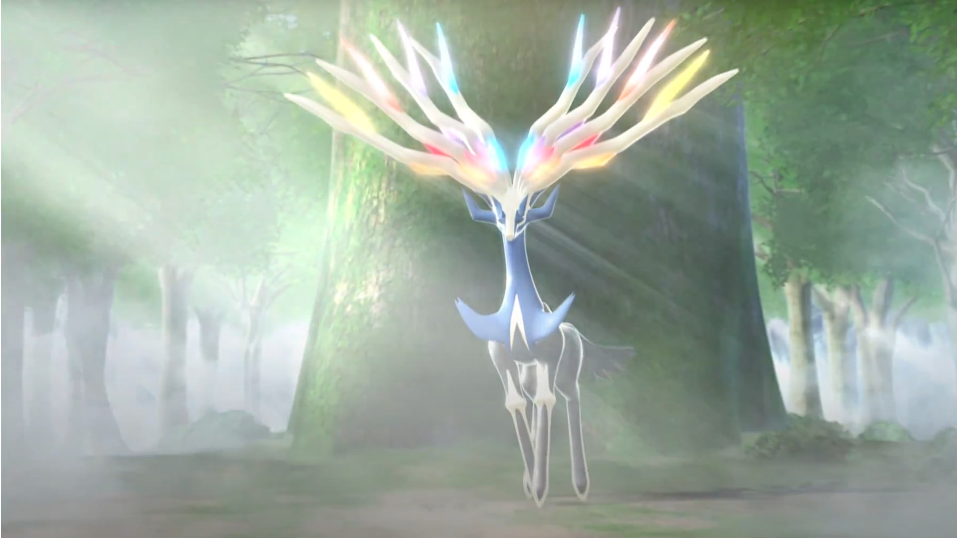 Legendary Pokémon Xerneas appearing in a forest in Pokémon X and Y