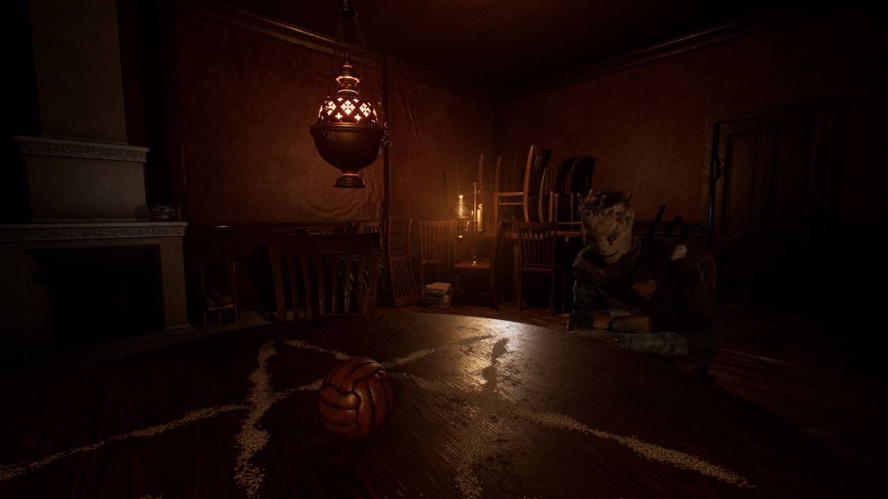 Ad Infinitum gameplay preview: Half of a pentagram on a wooden table with a lamp hanging from the ceiling, a ball in the middle of the table, and a dummy sat opposite.