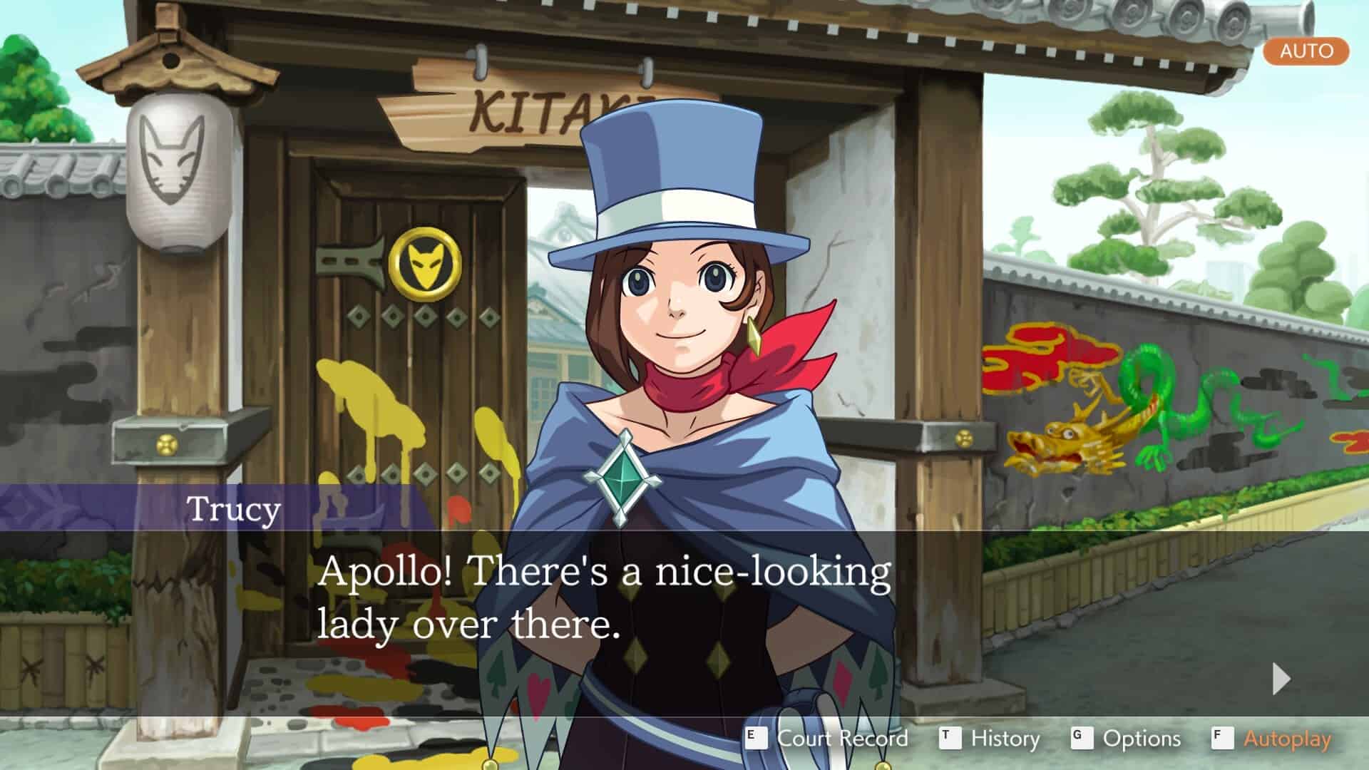 A girl in a top hat is standing in front of a building.