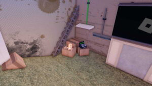 A Bathe da Baby player sitting on a crate, next to a cash register.