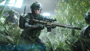 Battlefield 2042 Game Pass - A soldier is holding a rifle in the grass. Image from EA.
