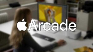 A woman is sitting in front of a computer with the word "arcade" displayed on the screen.