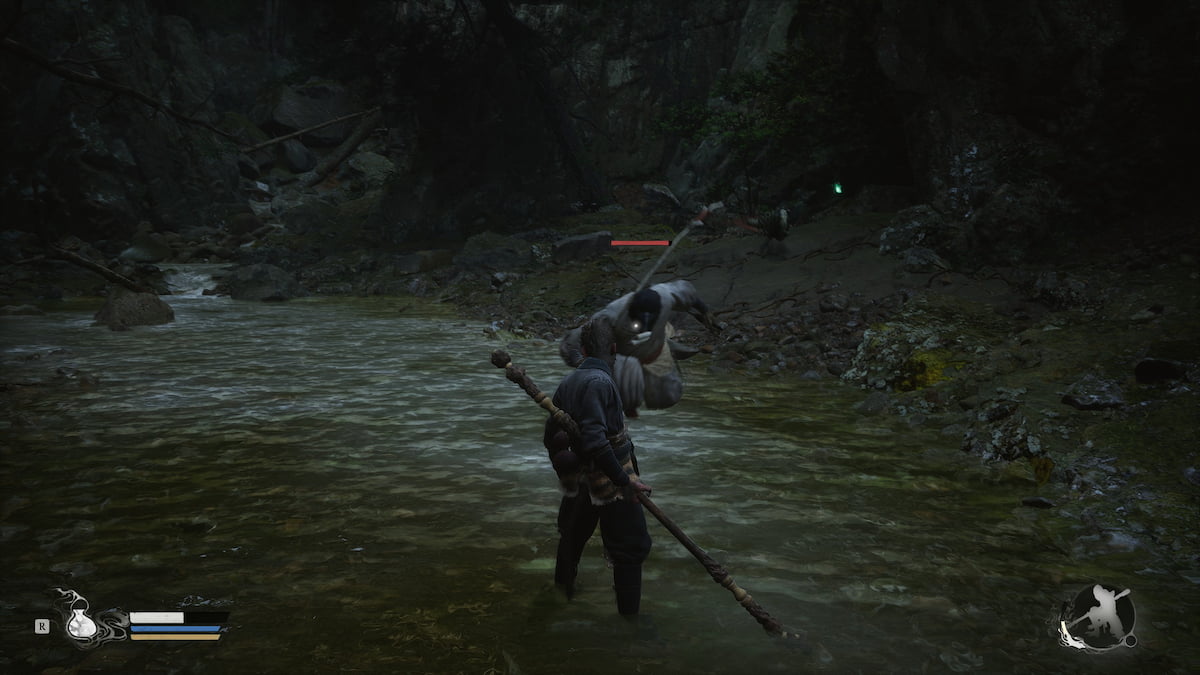 Image of player character facing a bird elite enemy near a waterfall in Black Myth: Wukong.