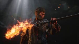 Black Myth Wukong editions and pre order: A monkey man holding a flaming torch.