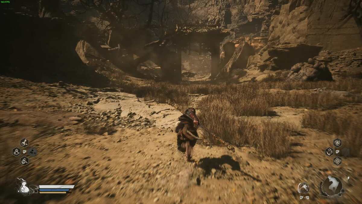Black Myth Wukong how to sober up drunk pig: The player running towards a stone gate in Black Myth Wukong.