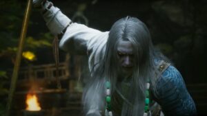 The Whiteclad Noble grasping his spear in Black Myth Wukong.