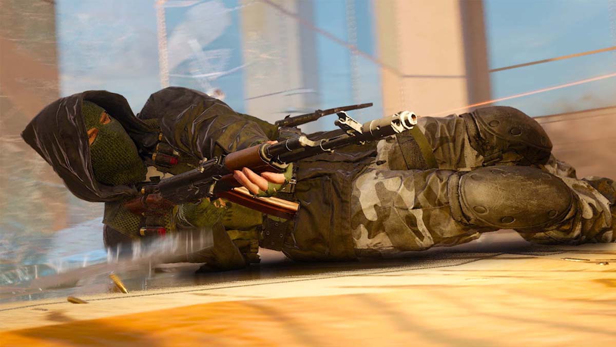 Black Ops 6 player sliding along the ground while aiming with assault rifle