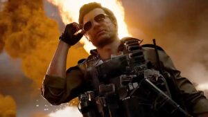 A scarred man puts on shades while something explodes in the background