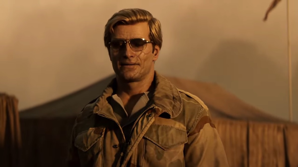 A character stands in the desert.