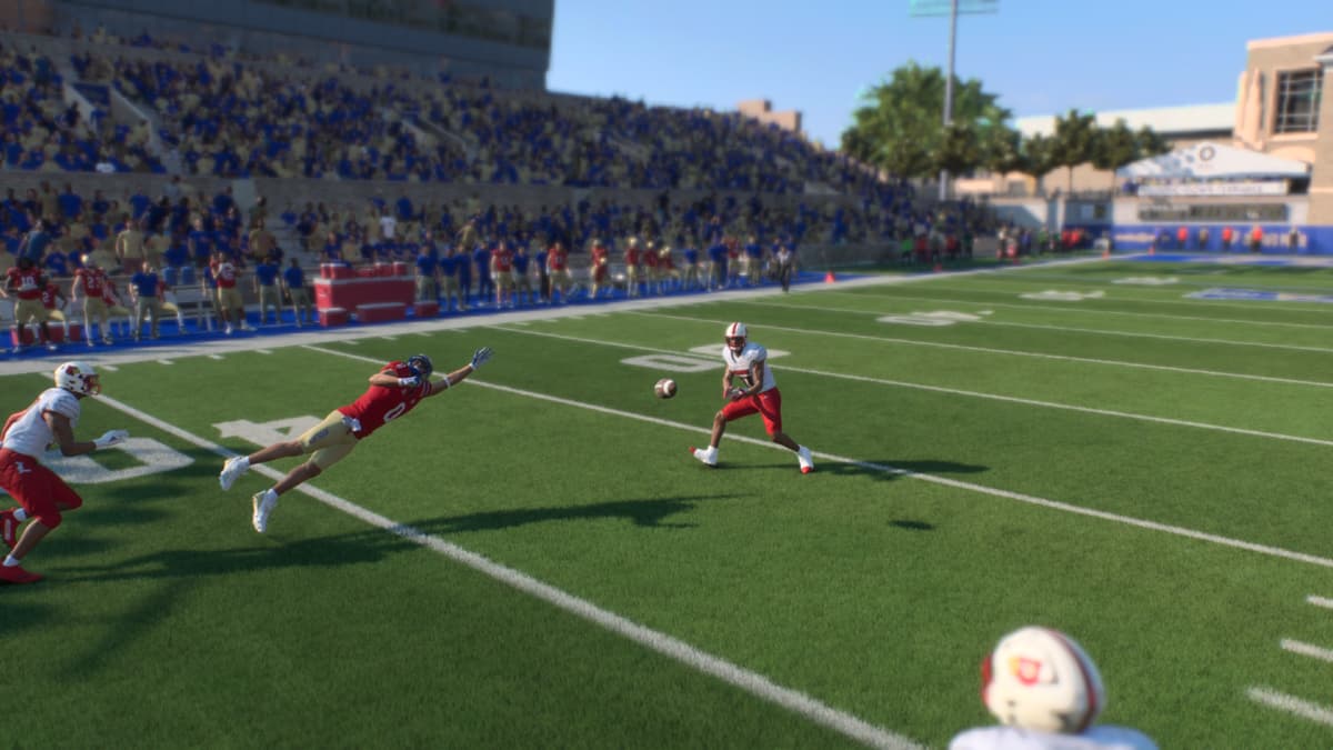 A defensive player intercepts the pass in College Football 25