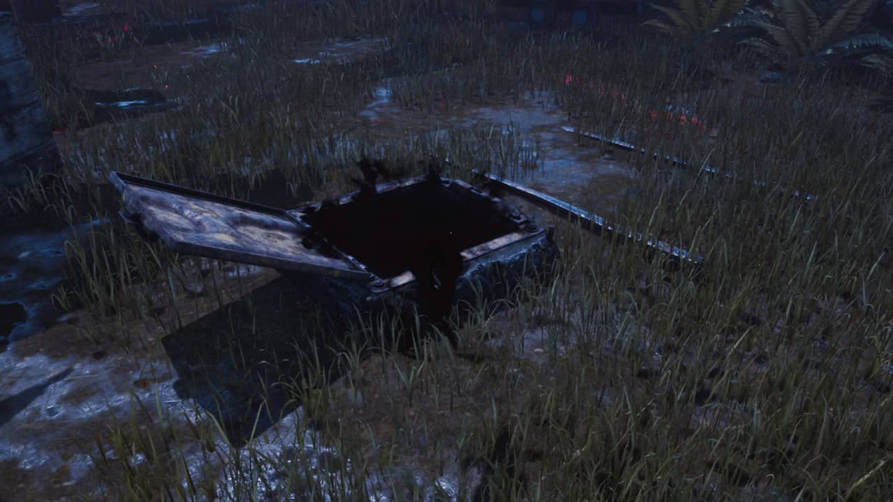 Dead by Daylight how to find the hatch - Our tips on how to open, close and locate it: An open hatch on the ground among tall grasses.