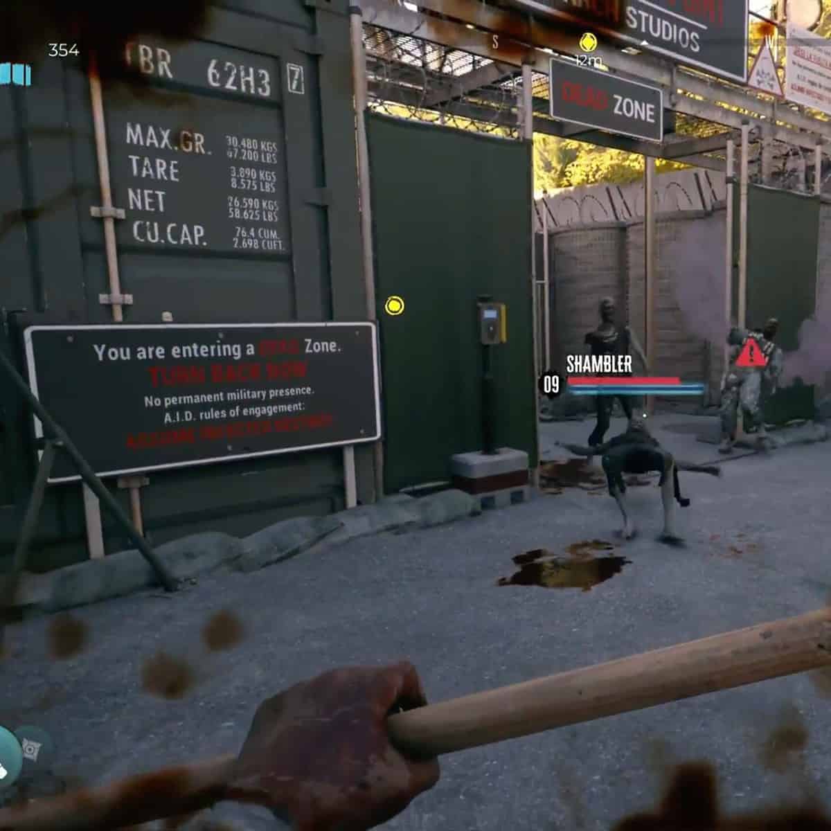 Dead Island 2 max level: A Shambler on the floor after being kicked back next to two zombies standing.