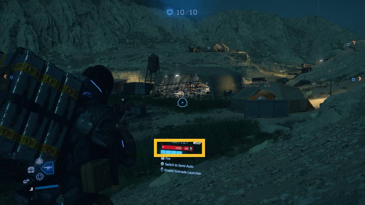 Death Stranding 2 healing blood bags: Sam outside a bandit camp.