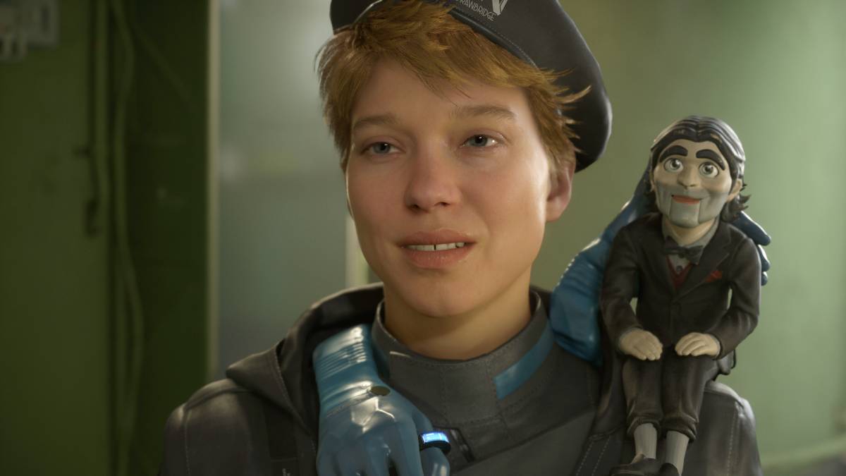 Death Stranding 2 PS5 Pro Enhanced: dummy sitting the shoulder of a woman wearing a beret.