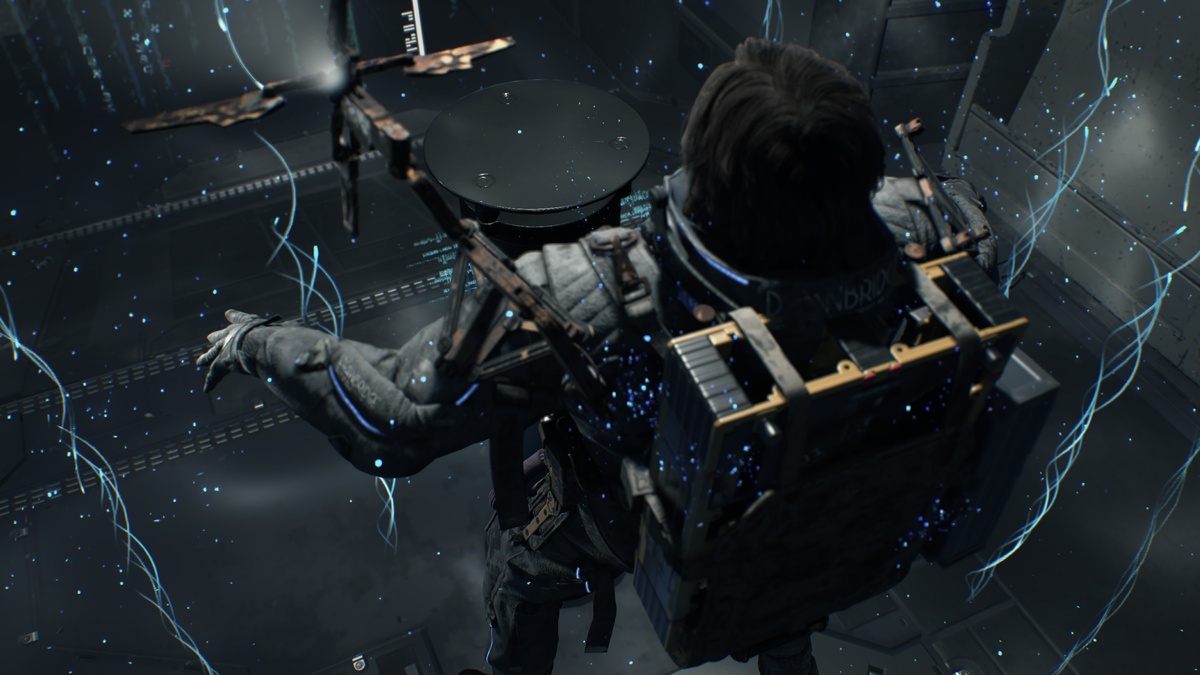 Death Stranding 2 review: Sam connecting the Q-Pid in a facility.