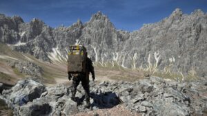 Death Stranding 2 review: Sam below a mountain range.