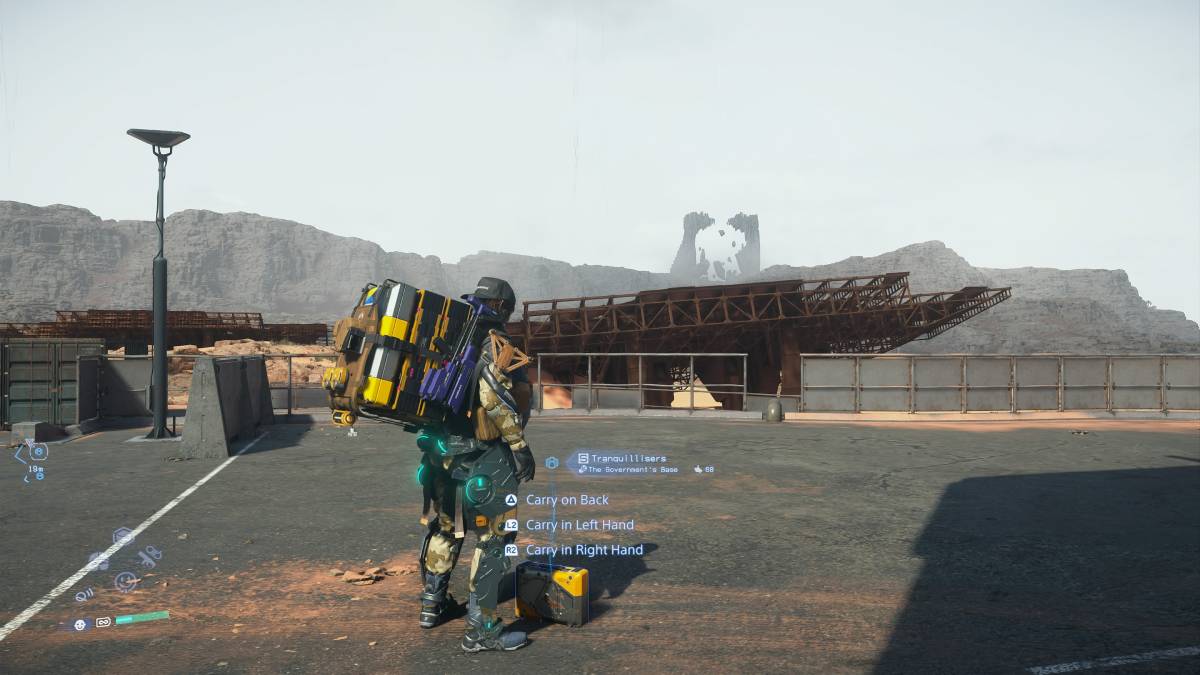 Death Stranding 2 throw cargo: Sam picking up cargo.
