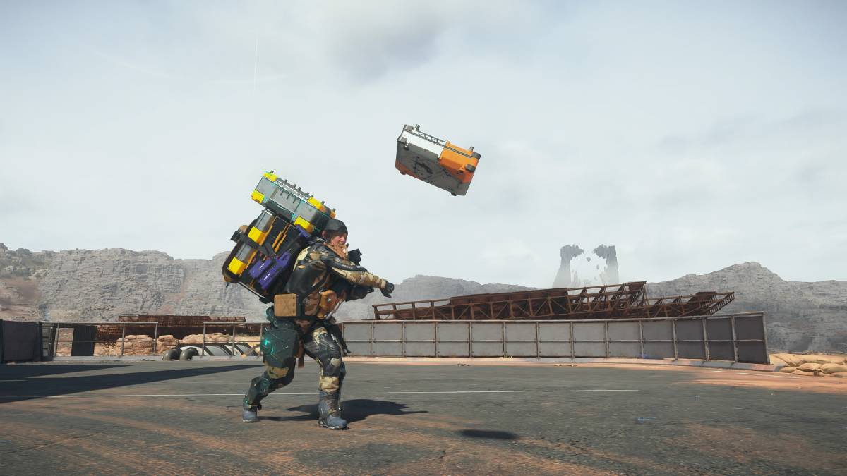 Death Stranding 2 throw cargo: Sam throwing cargo.