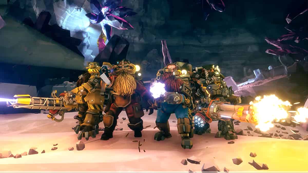 A group of players standing in front of a cave, exploring in Deep Rock Galactic.