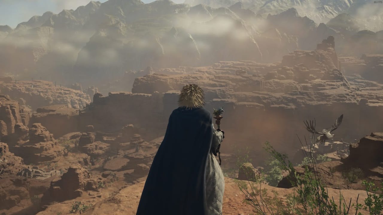 Dragon's Dogma 2 best staff: A player holds the Goblin Bane and looks at a canyon in Battahl. Image captured by VideoGamer.