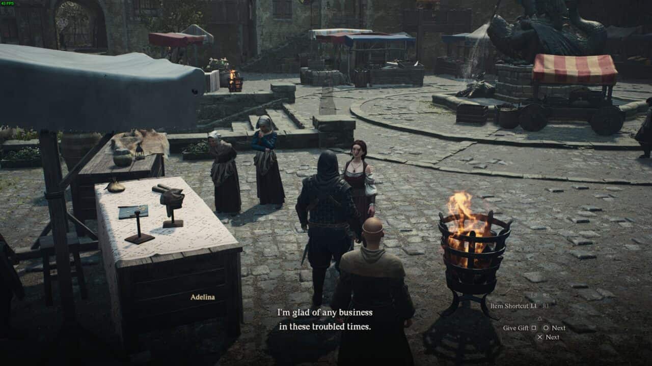 A scene from Dragon's Dogma 2 showing a character interacting with a vendor at a market stall with other stalls and a dragon statue in the background to purchase gifts.