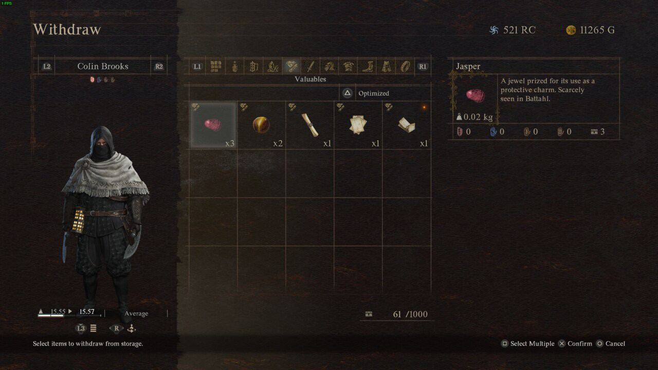 A character in a hooded cloak stands next to an inventory screen from Dragon's Dogma 2, highlighting a selected item called "Jasper," described as a protective charm.