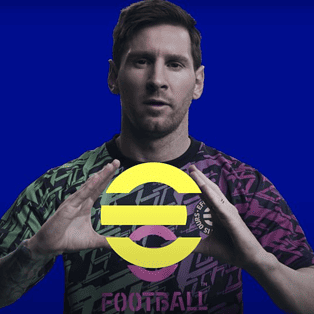 Lionel Messi holds up an eFootball logo in front of a blue background.