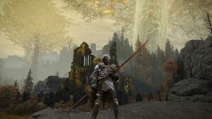 Elden Ring Eleonora's Poleblade: A player wielding Eleonora's Poleblade standing in front of a church with the Erdtree high in the background.