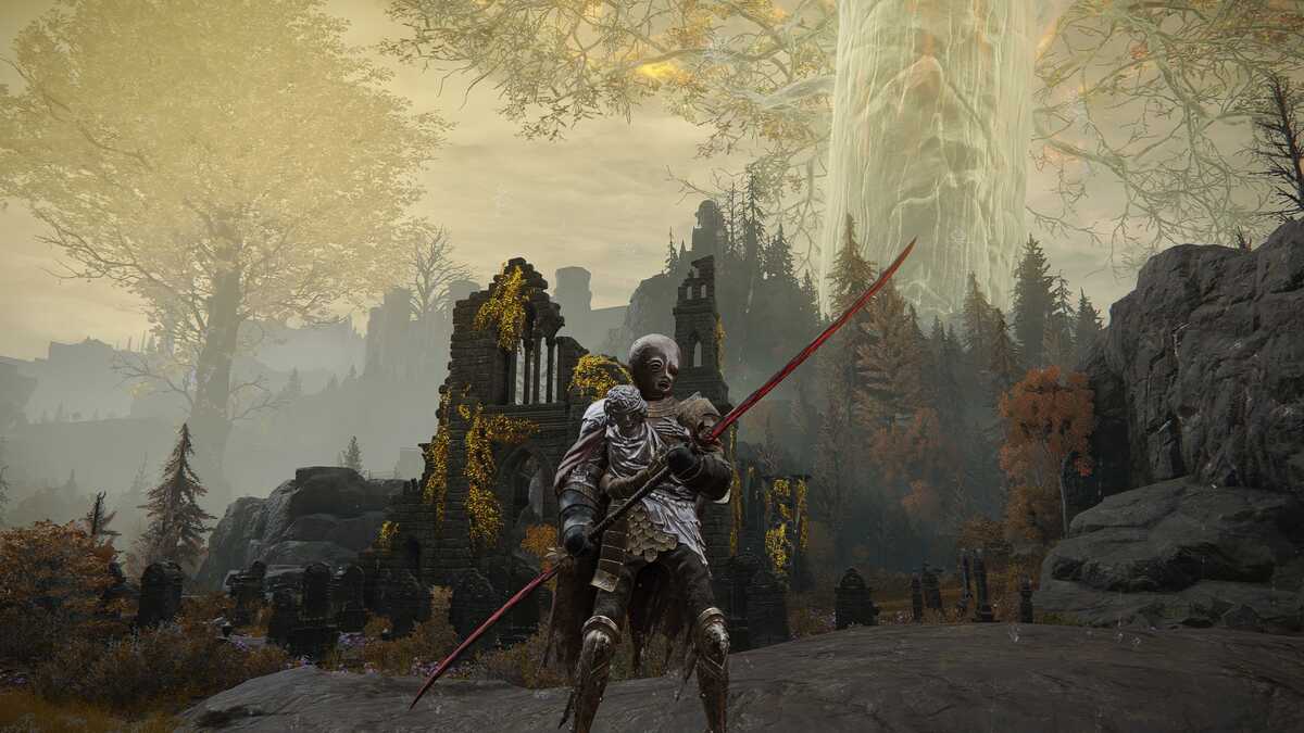 Elden Ring Eleonora's Poleblade: A player wielding Eleonora's Poleblade standing in front of a church with the Erdtree high in the background.