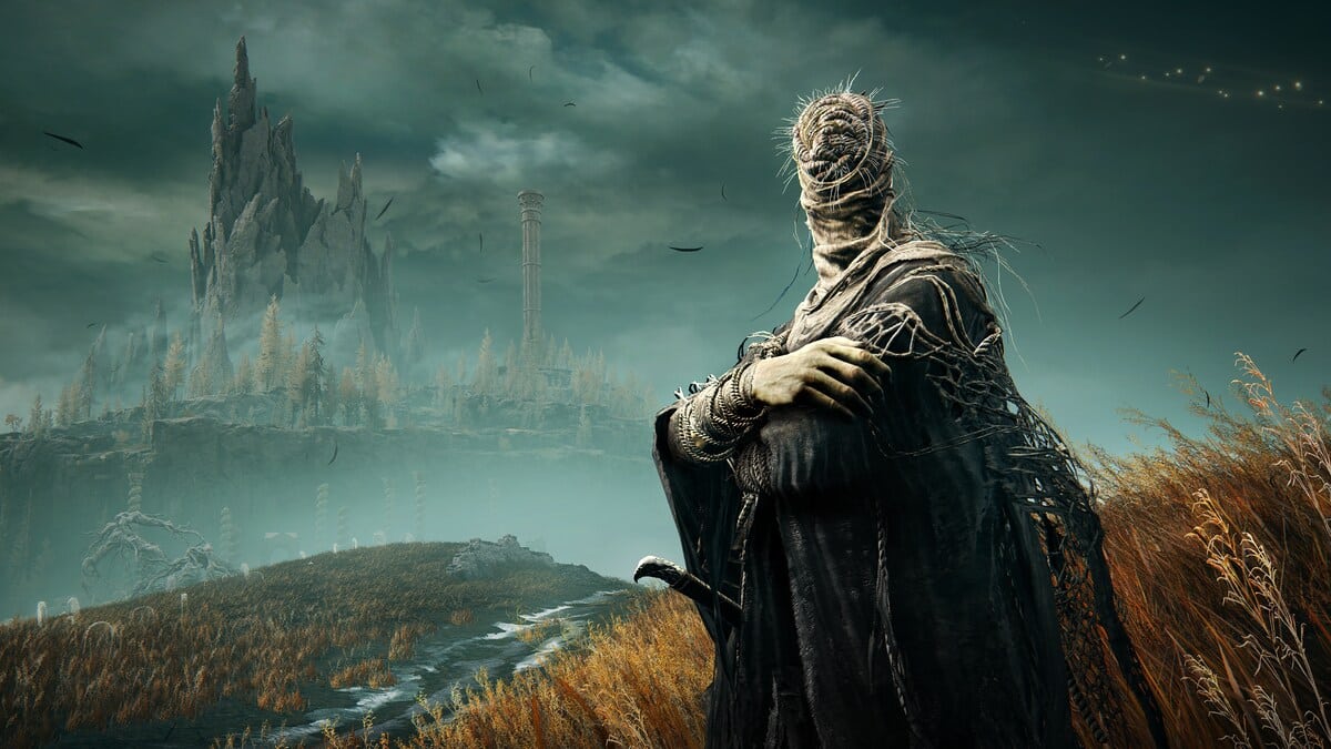 Elden Ring Shadow of the Erdtree preview: armoured figure stands in a desolate, foggy landscape with tall, jagged castle in the background.