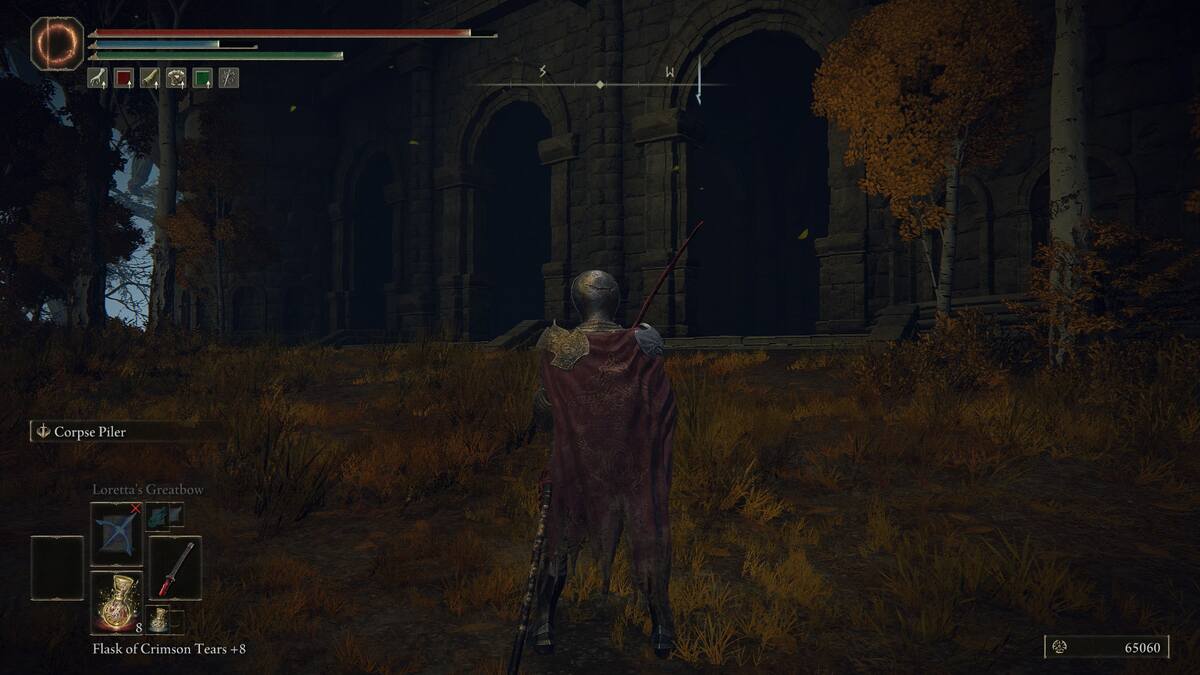 Elden Ring Star Fists: A player standing in front of an alcove at the bottom of a colosseum.