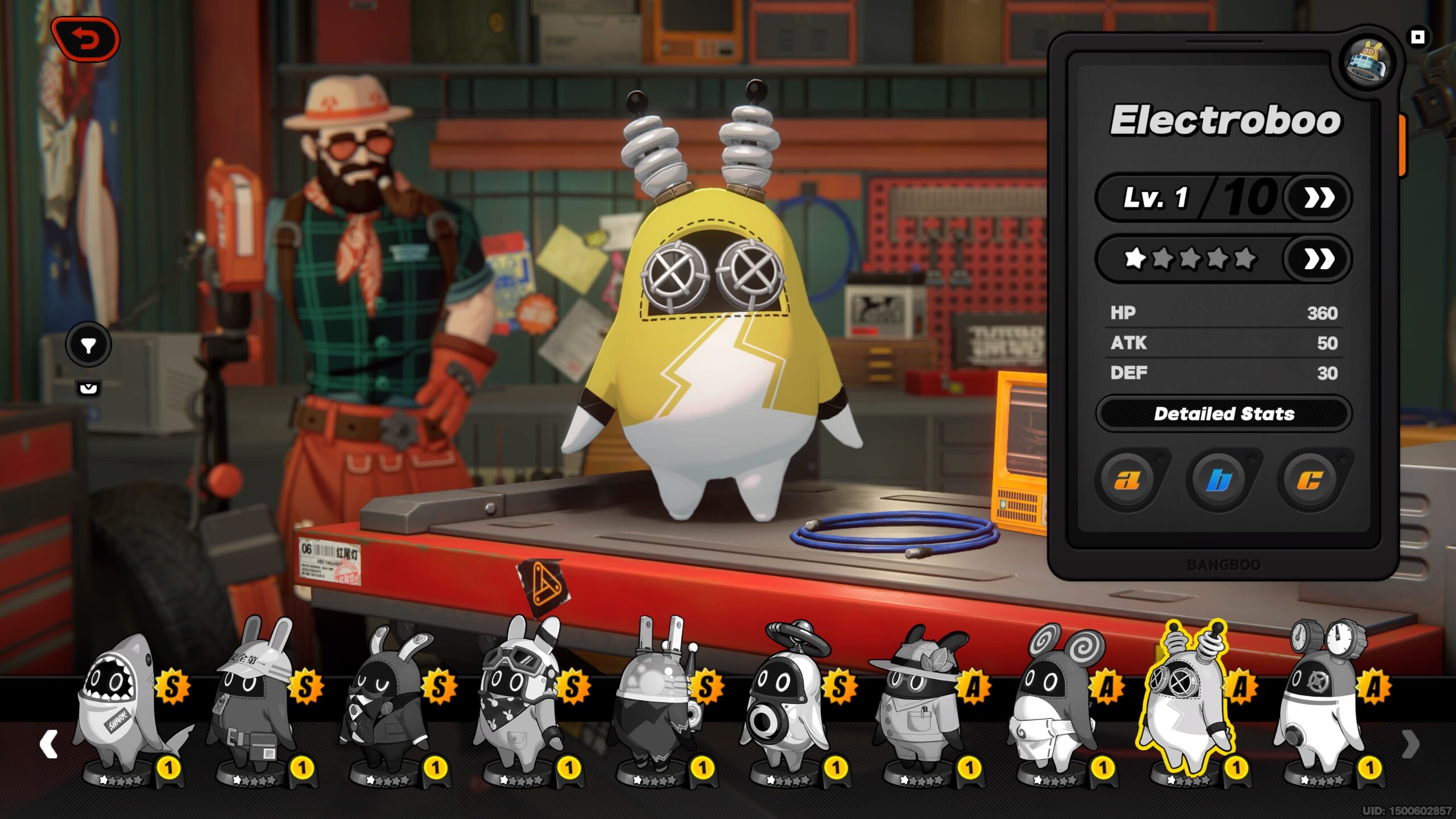 a little creature wears a yellow outfit standing on a workbench