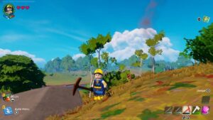 A character dressed as a construction worker holding an axe in a vibrant, colorful Fortnite LEGO landscape with trees and a clear sky.