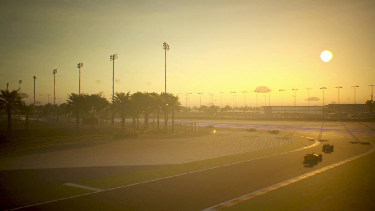 F1 Manager 2023 preview: The sun sets around Bahrain as cars drive round the track.