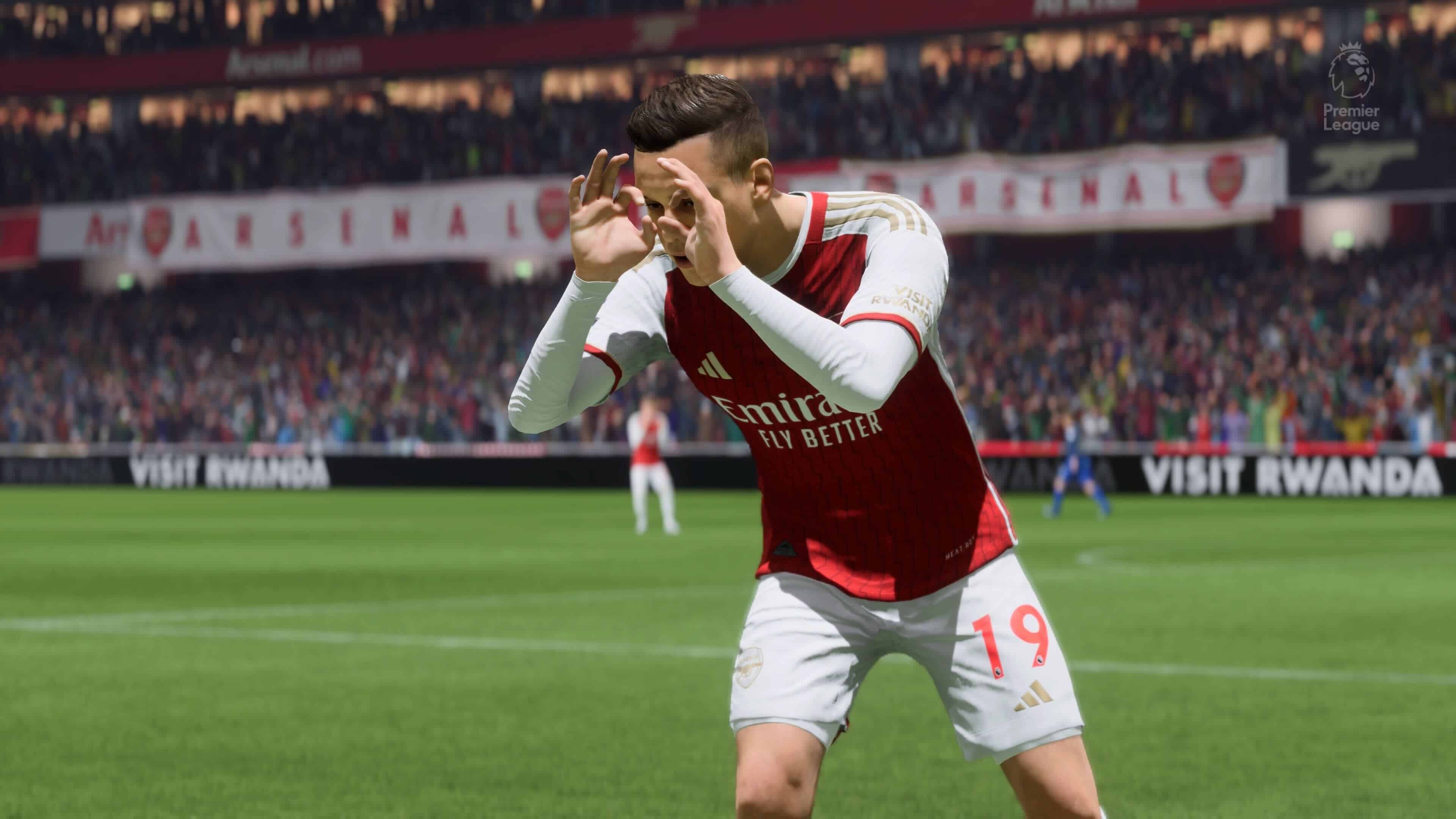 A pacey winger from FC 24 is holding his hands up in a video game, showcasing the evolution of the player.