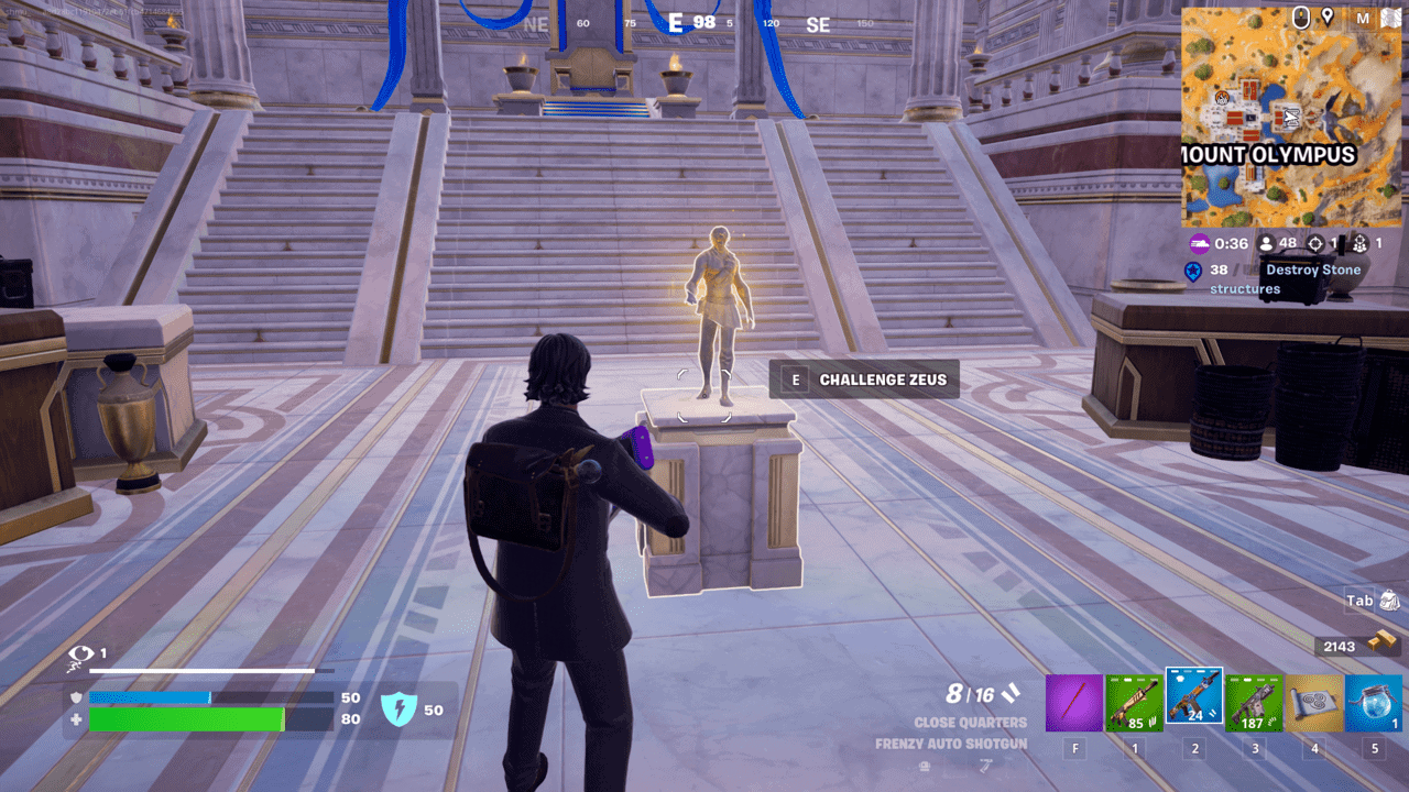 Fortnite how to get Aspect of the Gods: A player with an Alan Wake skin standing next to a small statue of Zeus in Fortnite.