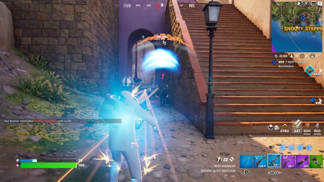 Player character in a blue outfit taking damage from an energy blast near vendor NPC locations in Fortnite Chapter 5 Season 2.