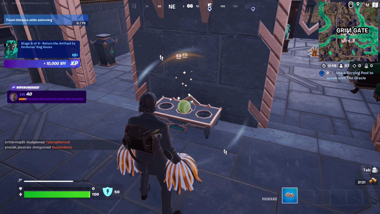 Fortnite Cerberus Snapshot: Placing a tennis ball on a small table next to a building.