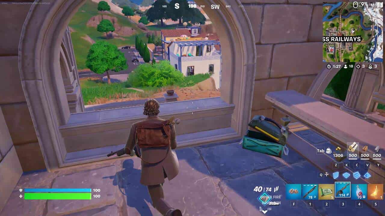 Fortnite how to destroy stone structures: Alan Wake looking through a stone archway in Fortnite.