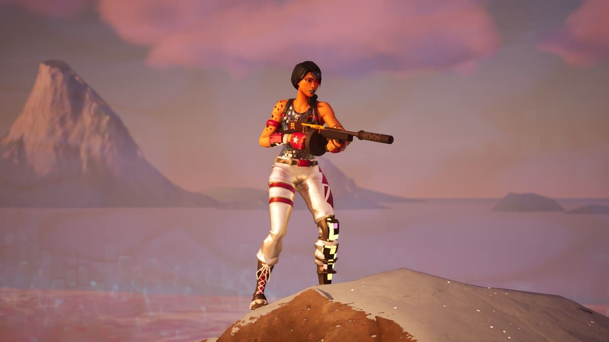 Fortnite how to get Legendary weapons: A female character holding a Drum Gun while standing on a snowy mountain peak.
