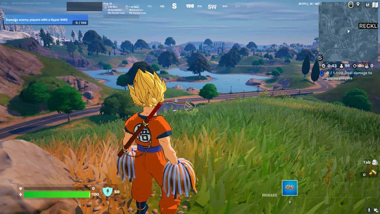 Fortnite how to get Legendary weapons: Goku standing on a hill overlooking a lake in Fortnite.